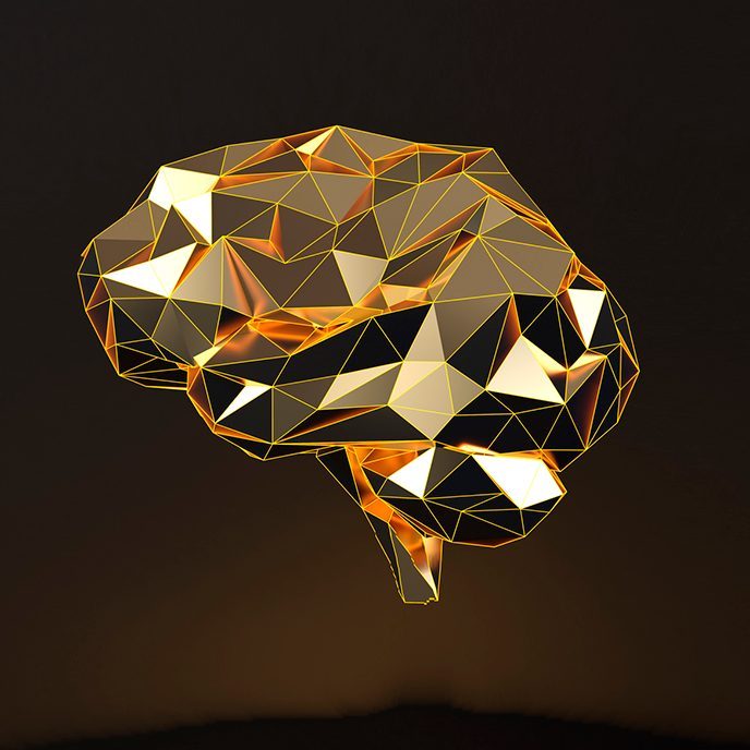 Grafisk illustration af en hjerne i farven guld med sort baggrund